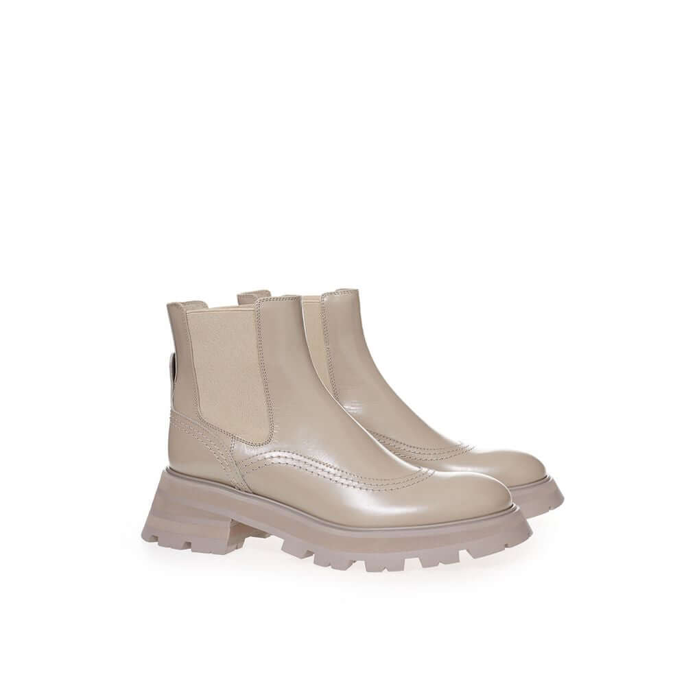 Chic gray leather boots by Alexander McQueen, featuring modern silhouette and luxurious craftsmanship for elegant style.