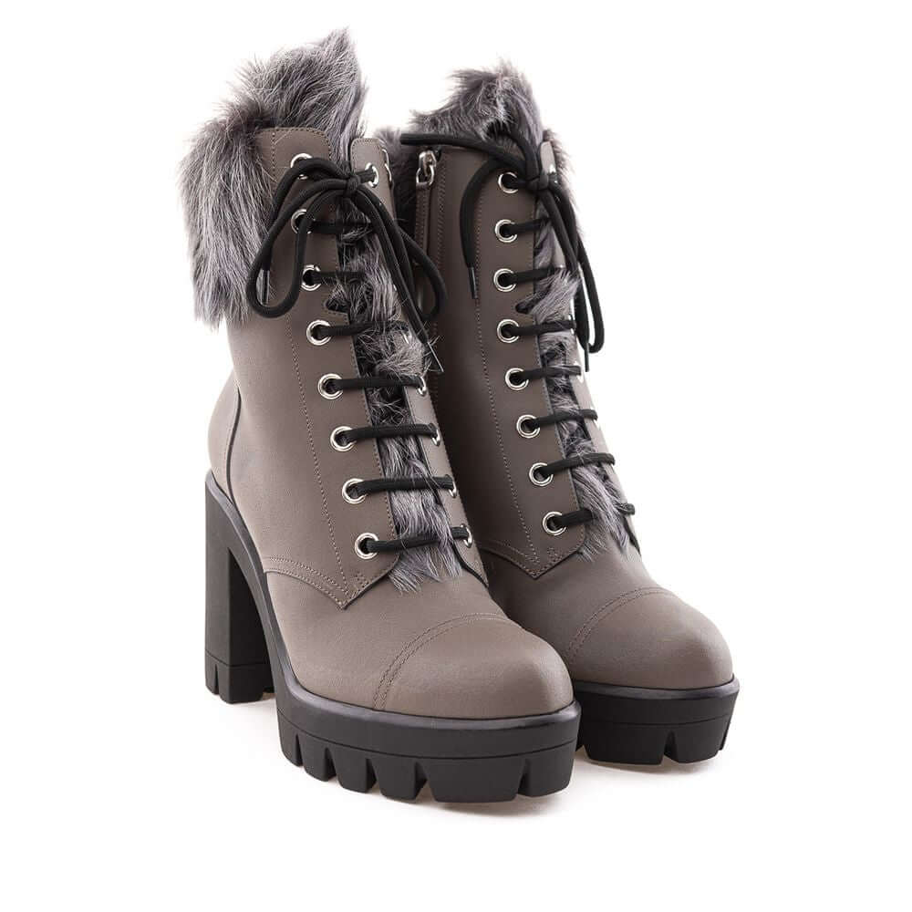 Giuseppe Zanotti gray eco leather combat boots with black notched sole, contrasting laces, side zipper, and faux fur accents.