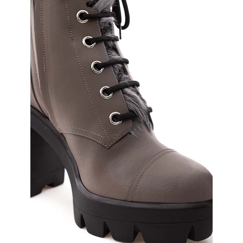 Giuseppe Zanotti gray eco leather combat boot with inner faux fur, black notched sole, and lace-up design.