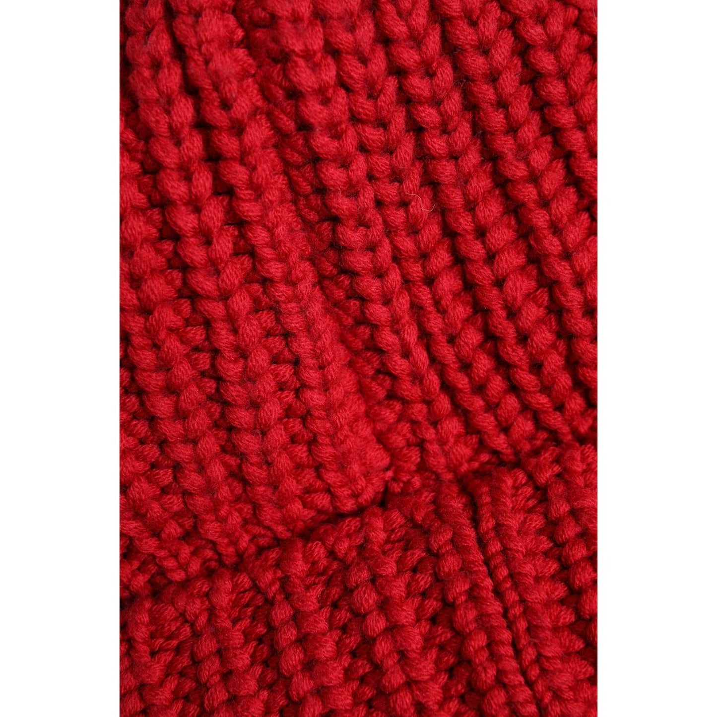Dolce & Gabbana red wool knitted winter beanie hat close-up showing texture. 100% virgin wool, made in Italy.