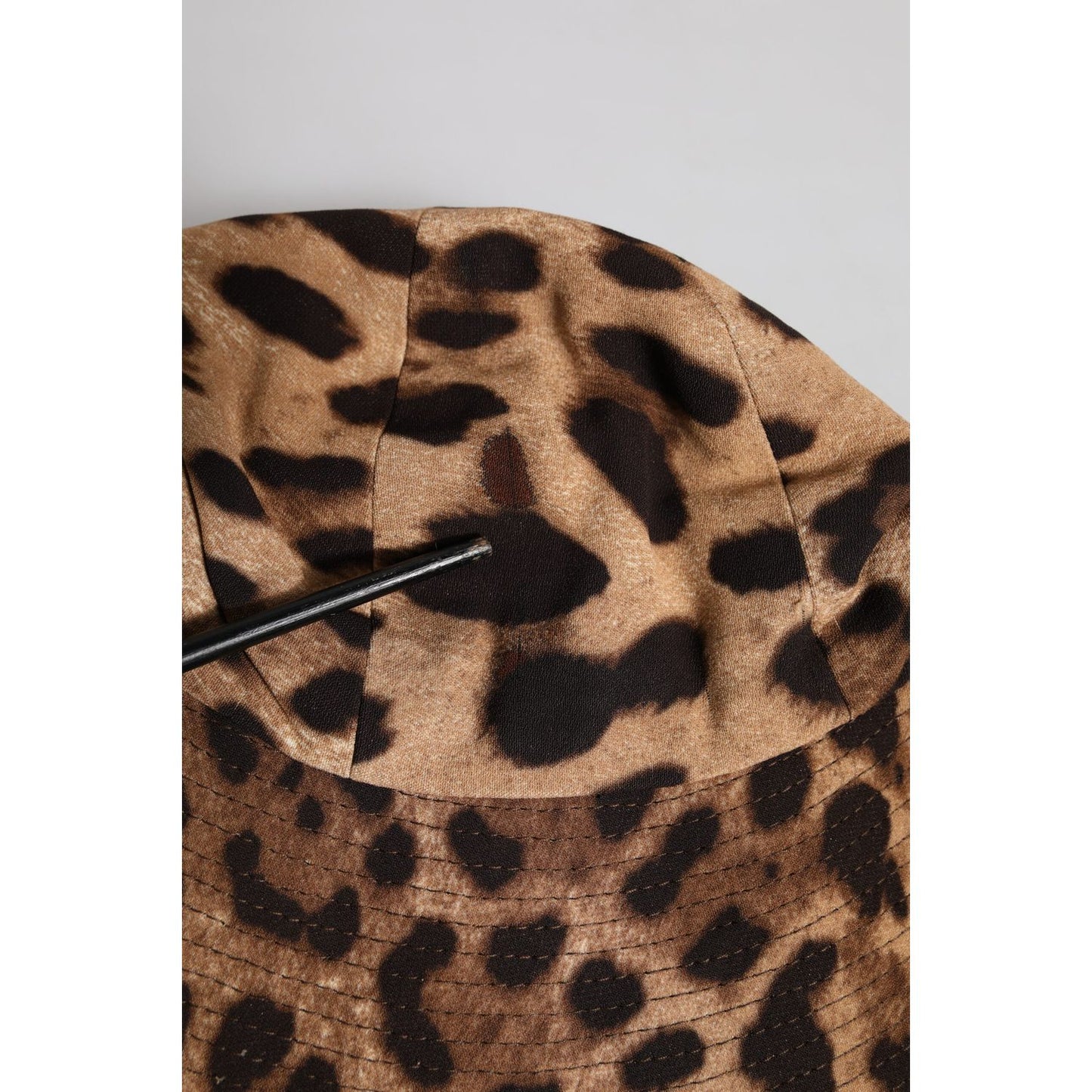Dolce & Gabbana brown leopard print women's bucket hat in viscose, showing minor defect with pulled threads.