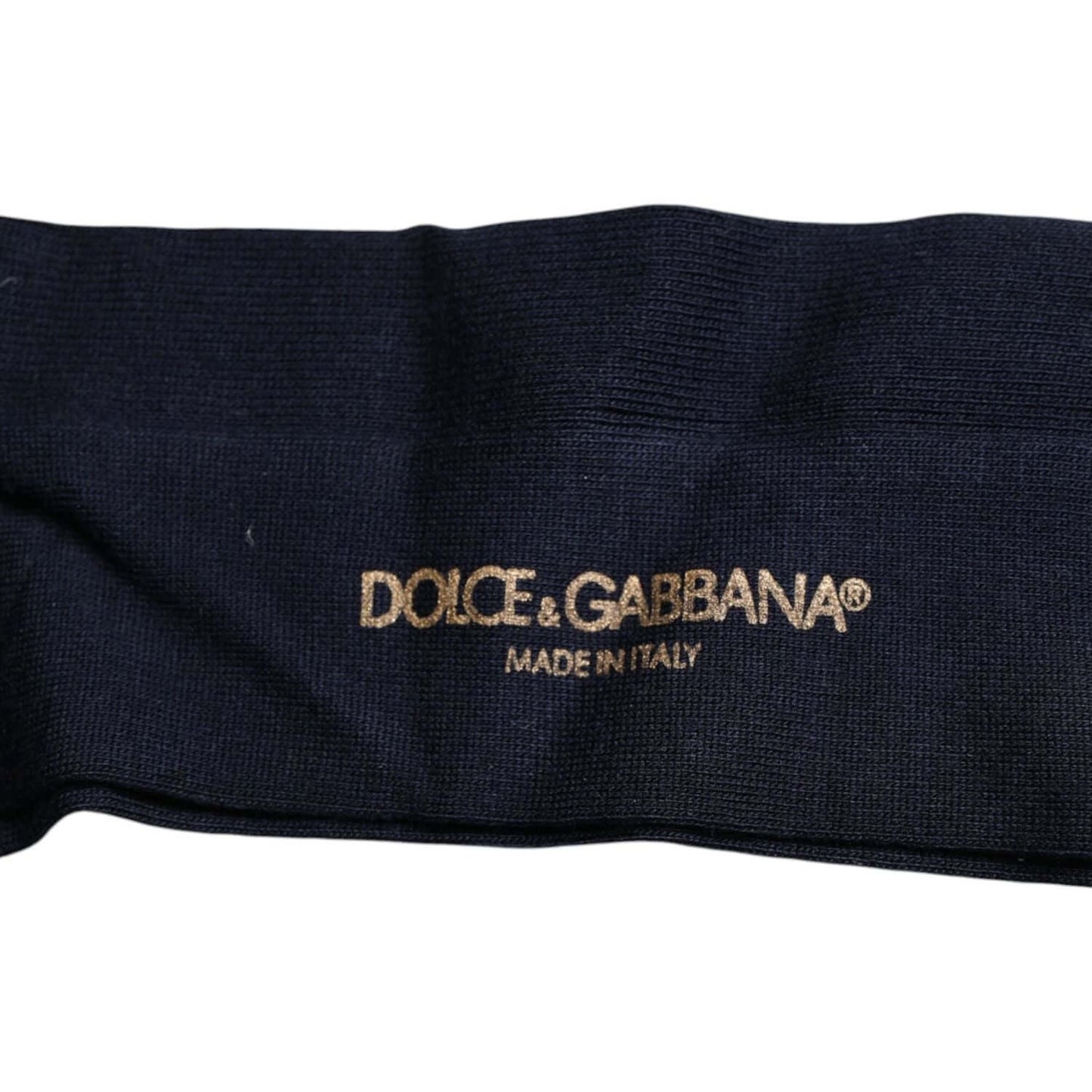 Dolce & Gabbana men's black viscose over the calf socks with gold logo, made in Italy. Fashionable and luxurious design.