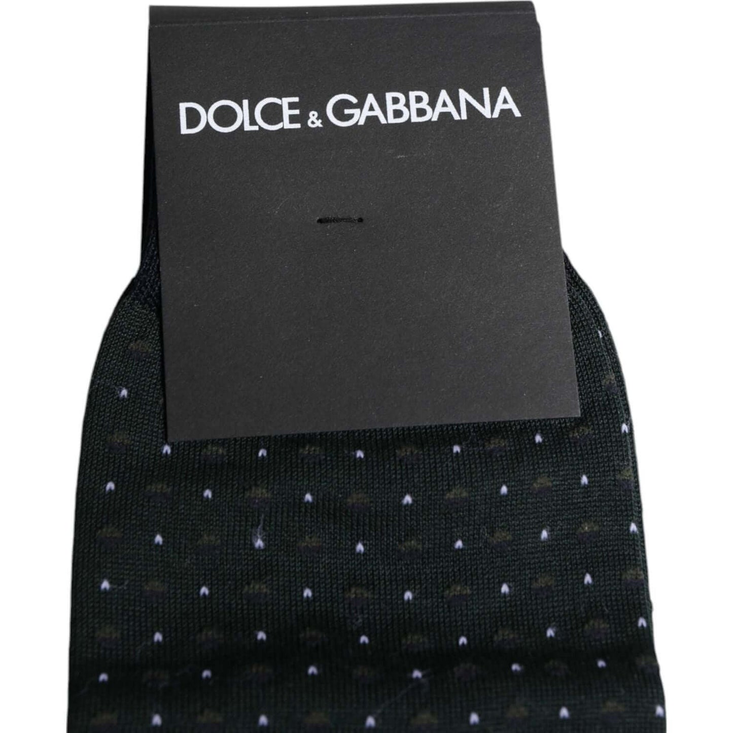 Dolce & Gabbana black polka dot cotton mid calf socks with minor defect, featuring brand logo, made in Italy.