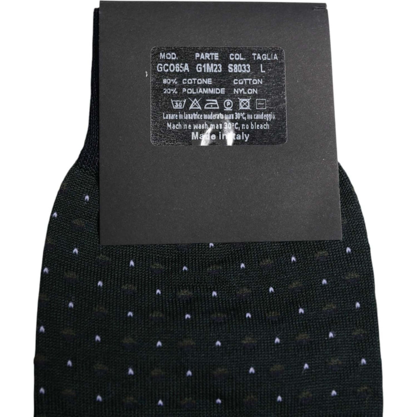 Dolce & Gabbana black polka dots cotton mid calf socks with label showing material and care instructions, made in Italy.