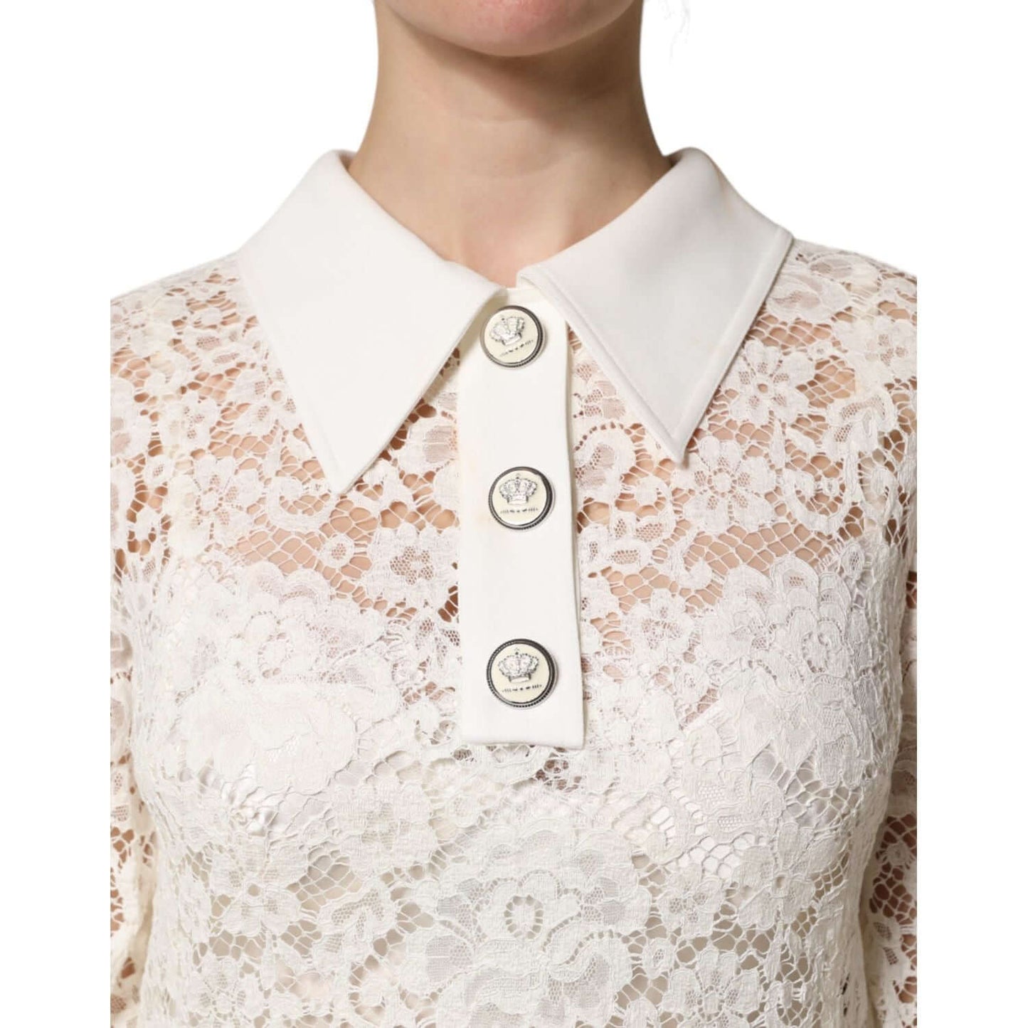 Close-up of Dolce & Gabbana white floral lace shift dress with buttoned collar detail, showcasing intricate design and craftsmanship.