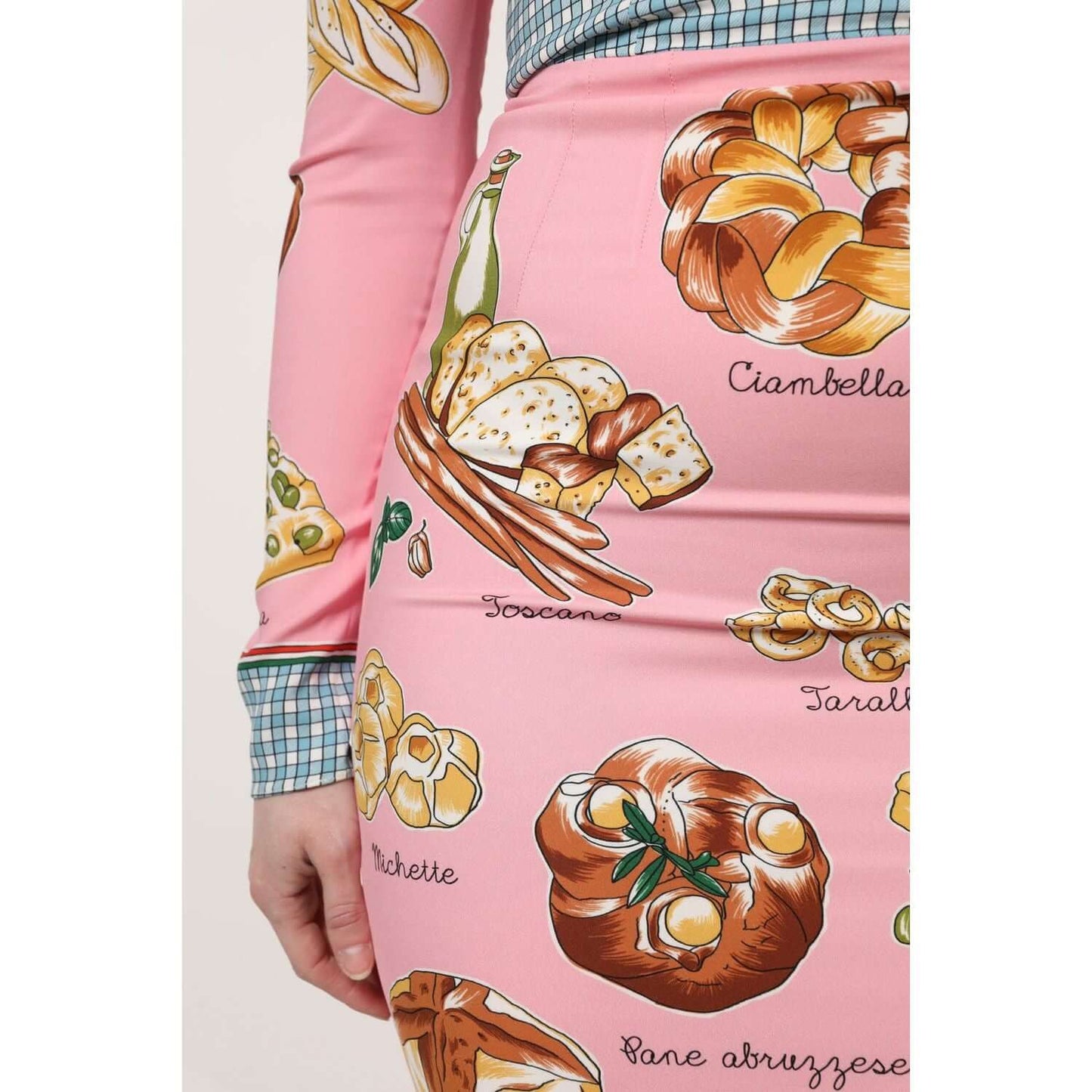 Dolce & Gabbana pink bodycon dress with pastry print, showcasing high craftsmanship and Italian design.