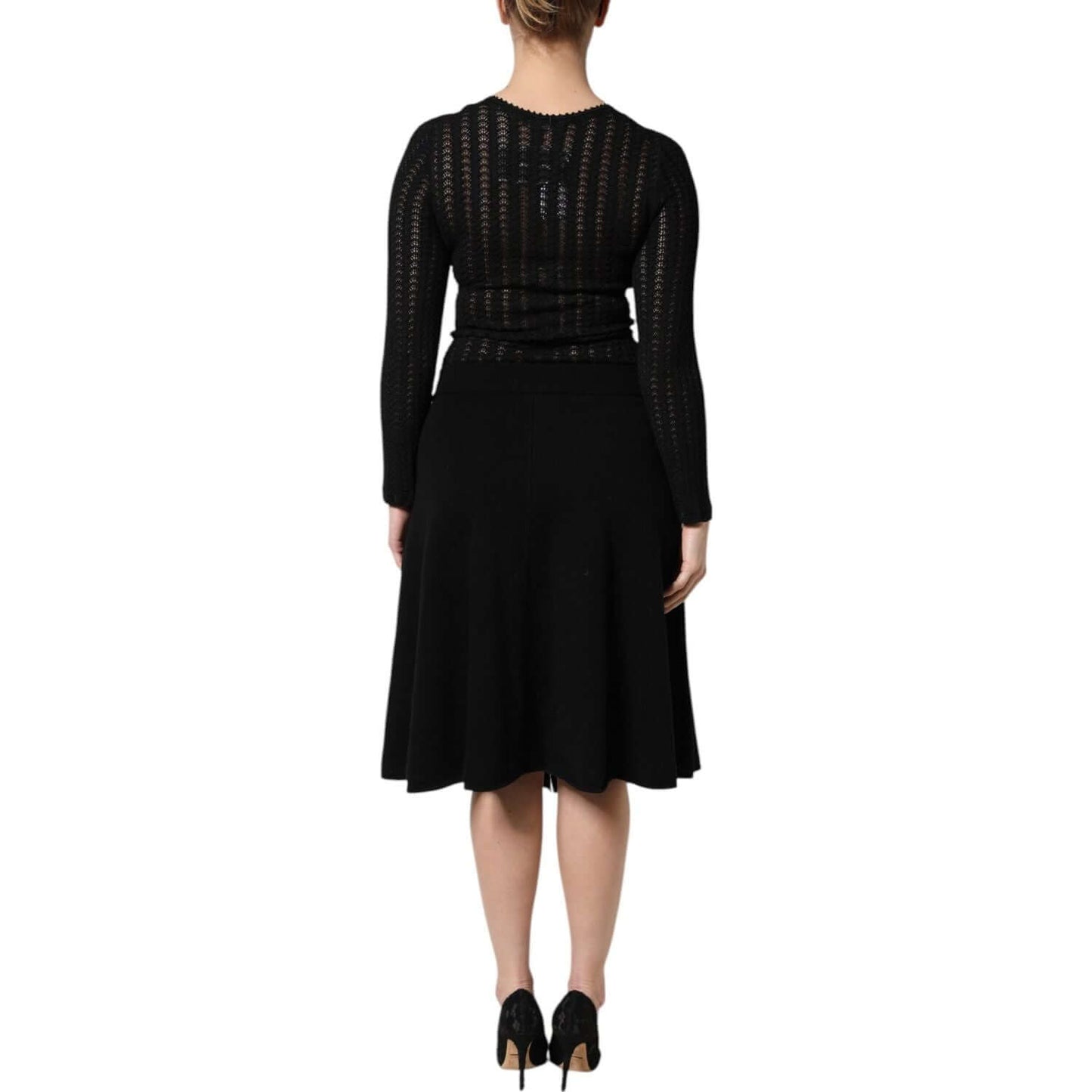 Back view of Dolce & Gabbana black cashmere long sleeve A-line midi dress with logo detail and zipper closure.