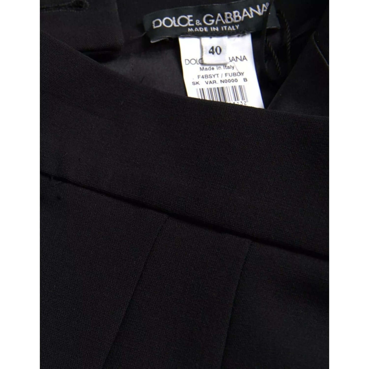 Close-up of Dolce & Gabbana black wool high waist midi skirt tag showing size and made in Italy label.