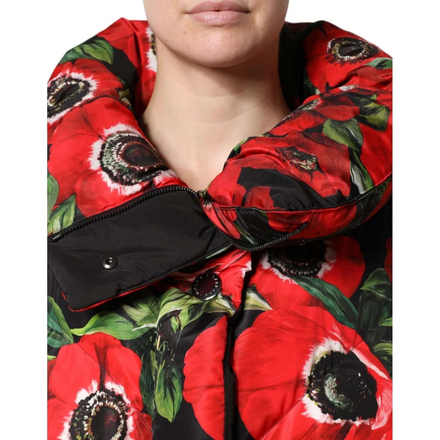 Dolce & Gabbana multicolor floral padded jacket close-up, featuring vibrant red and black flower design with full zip closure.