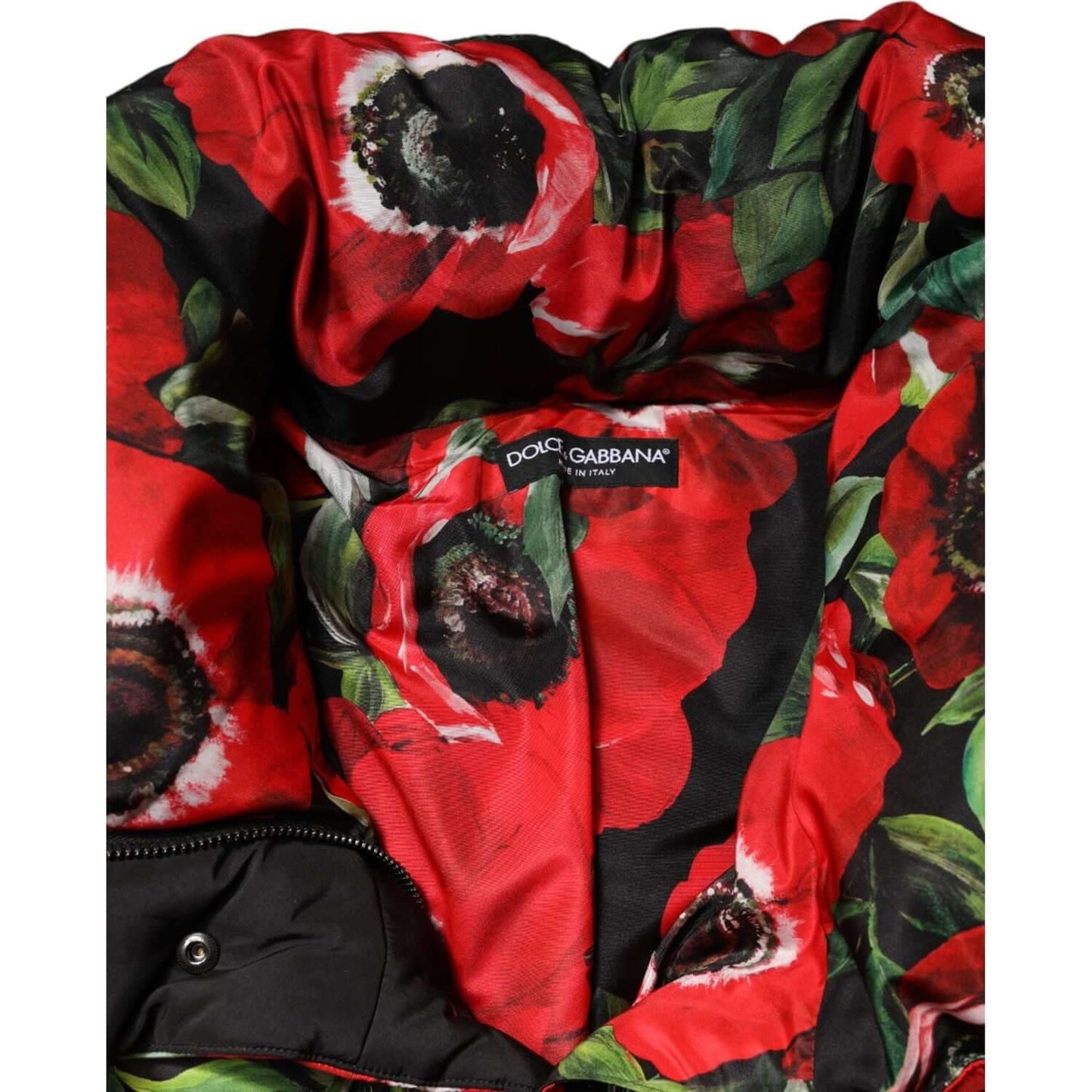 Dolce & Gabbana multicolor floral padded jacket interior with red flower design and brand label.