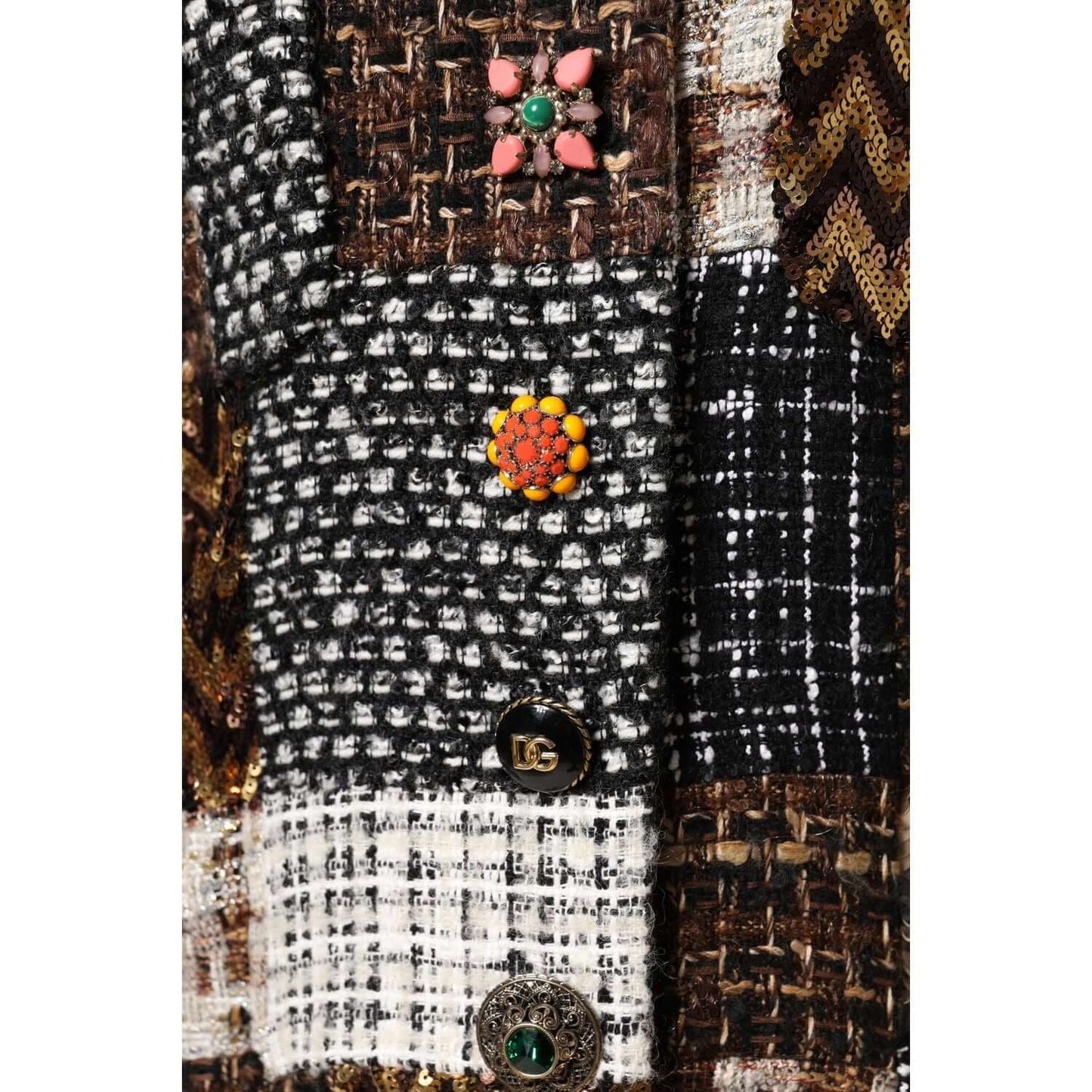 Close-up of Dolce & Gabbana multicolor patchwork button-down jacket highlighting unique button details and textured fabric design.
