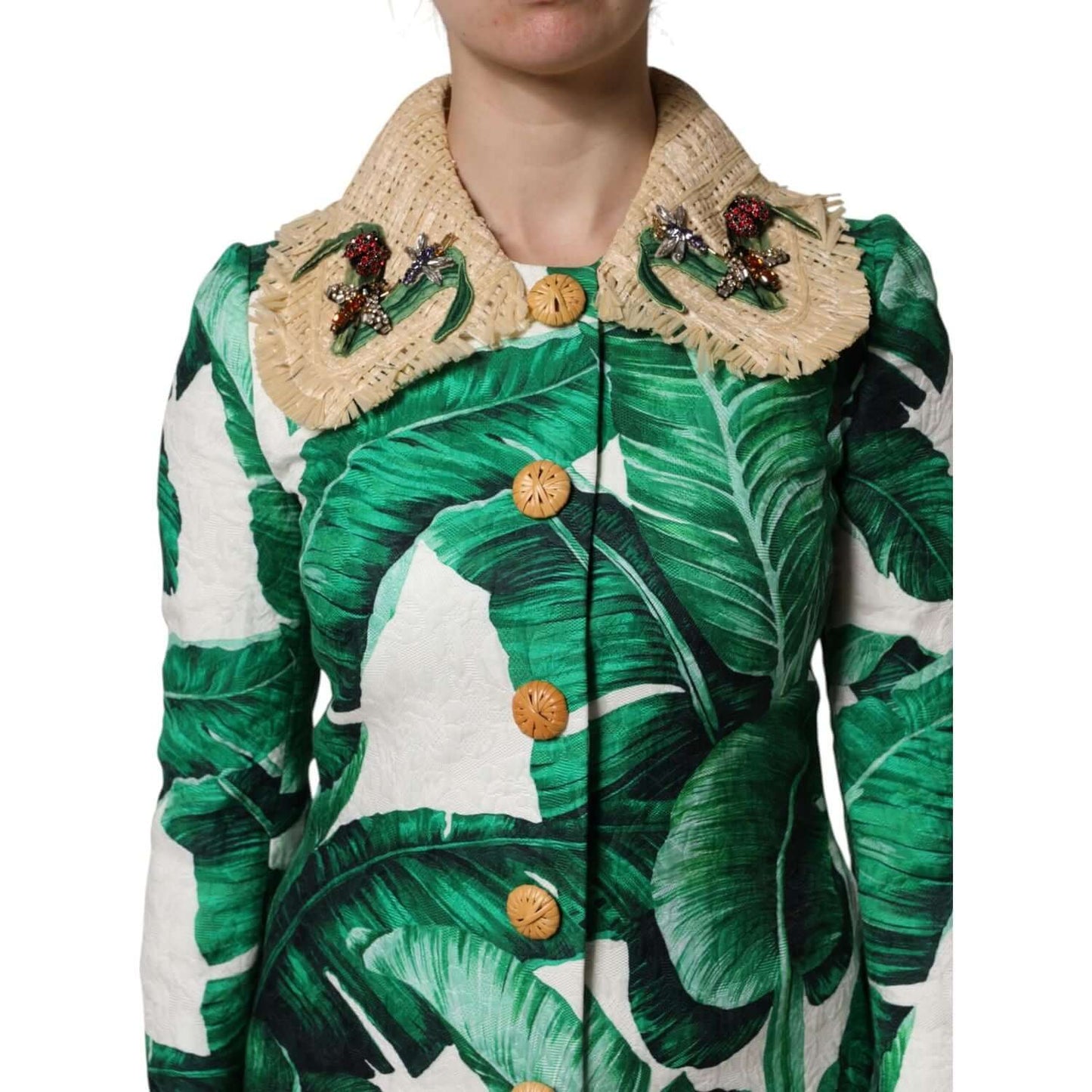 Dolce & Gabbana multicolor leaf print trenchcoat with embellished collar, featuring button closures and luxurious fabric detail.