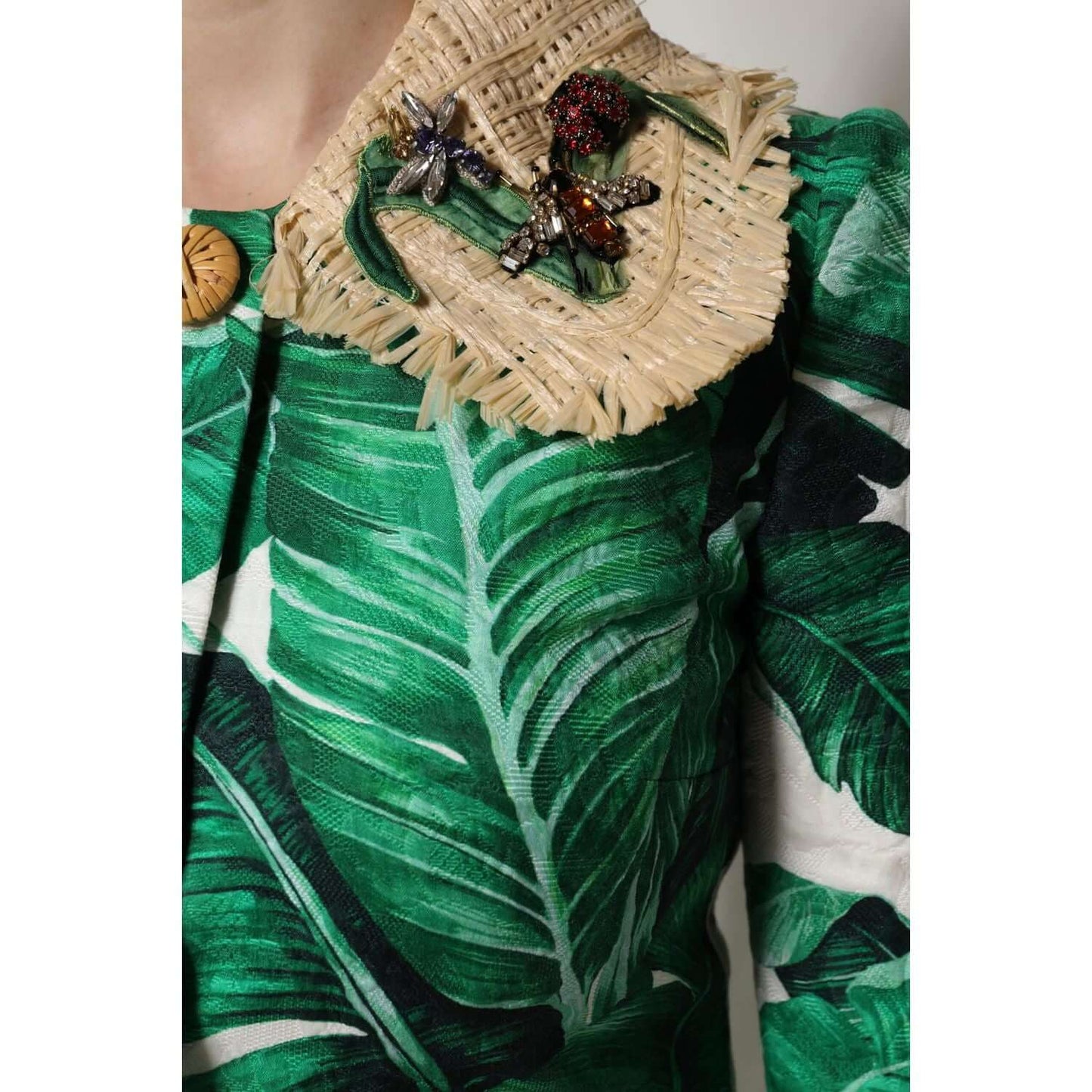 Dolce & Gabbana multicolor leaf print trench coat with embellishments, showcasing intricate details and luxury craftsmanship.