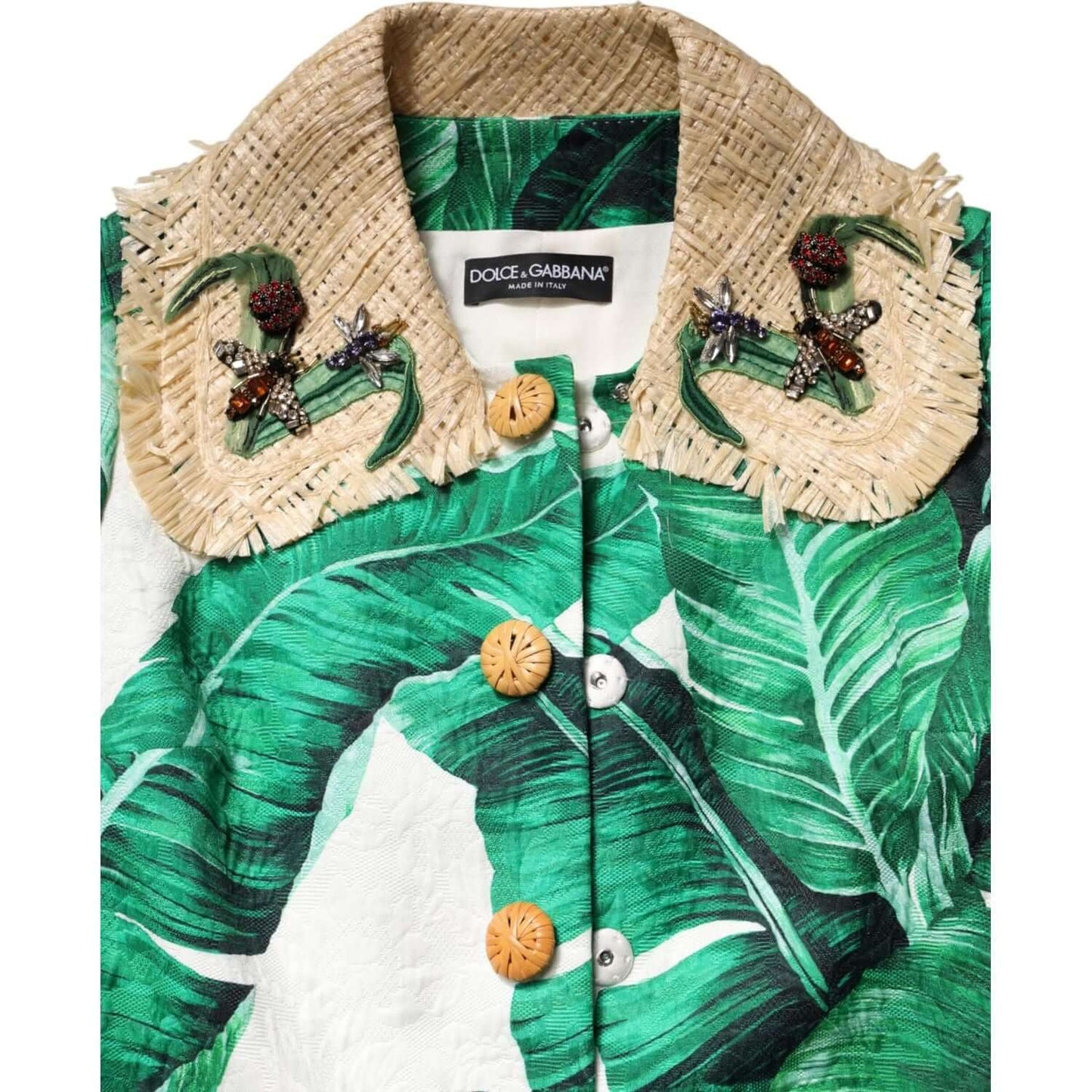 Dolce & Gabbana multicolor leaf print embellished trenchcoat with button closure and logo details, made in Italy.