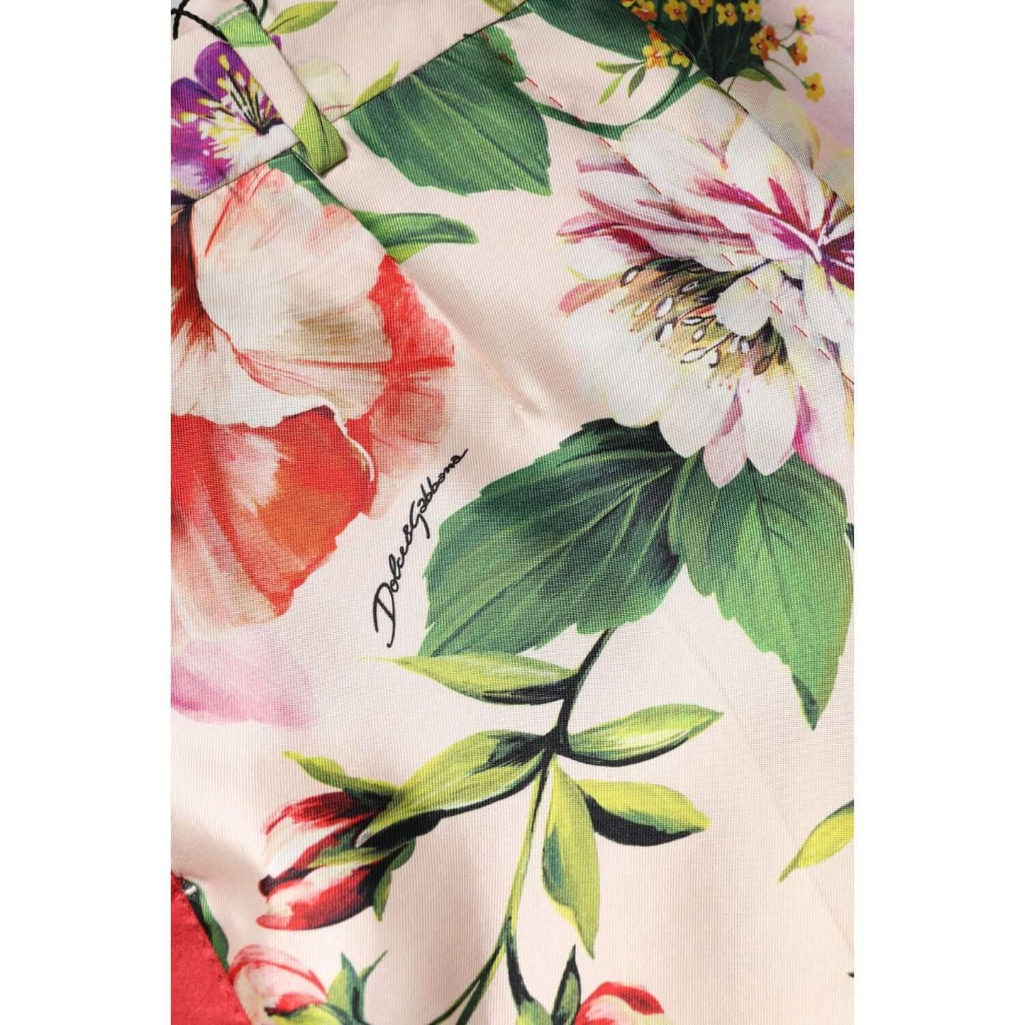Dolce & Gabbana multicolor floral high waist straight pants detail showing vibrant silk print and logo.