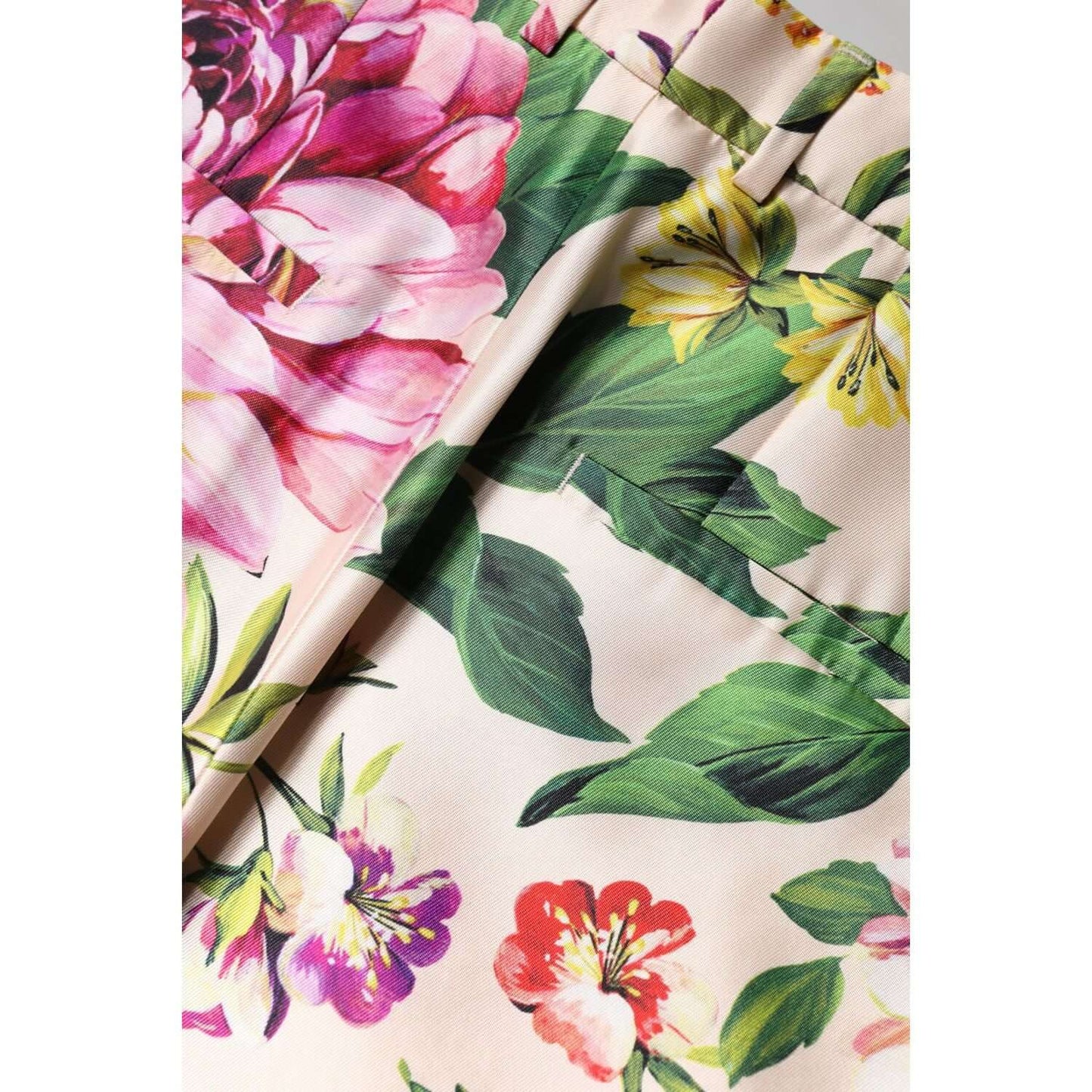 Dolce & Gabbana multicolor floral high waist pants showcasing vibrant flower patterns, silk blend fabric, and expert craftsmanship.