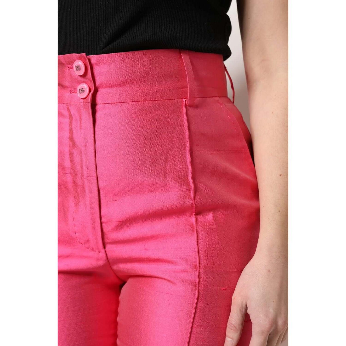Dolce & Gabbana pink silk high waist tapered pants with button detail, elegant and luxurious Italian design.