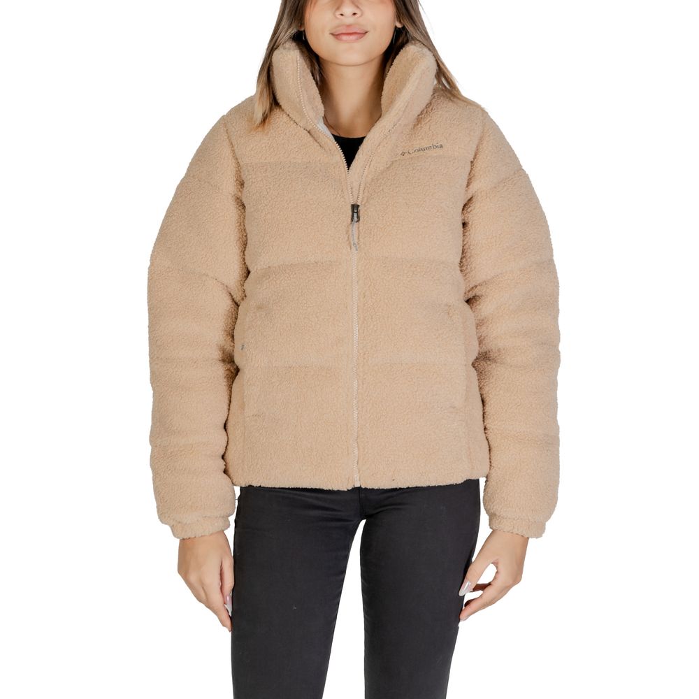 Woman wearing Columbia Beige Nylon Coat with soft Sherpa lining and zip closure, ideal for style and warmth in cold weather.