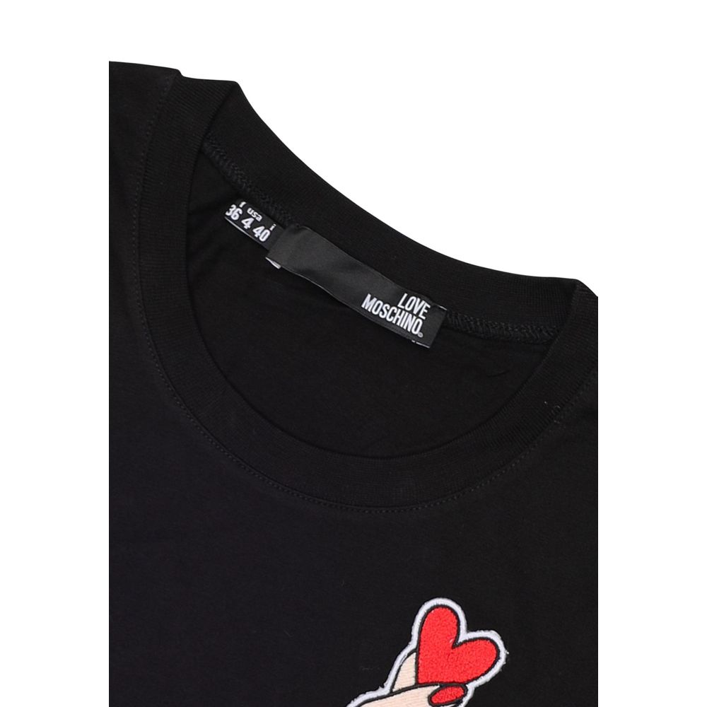 Close-up of Love Moschino Black Cotton T-Shirt with heart and hand print on collar detail.