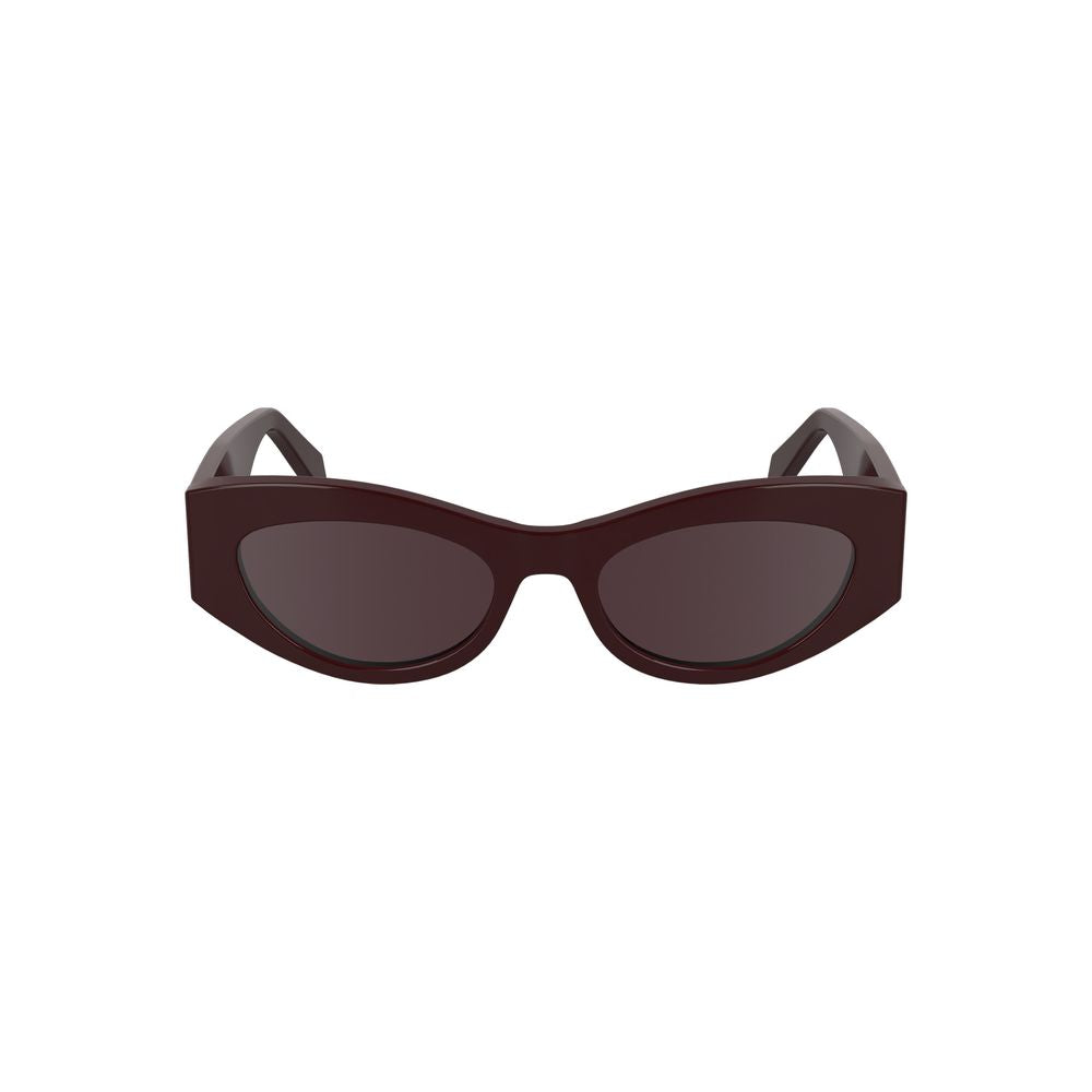 Calvin Klein red cat-eye acetate sunglasses with brown lenses.