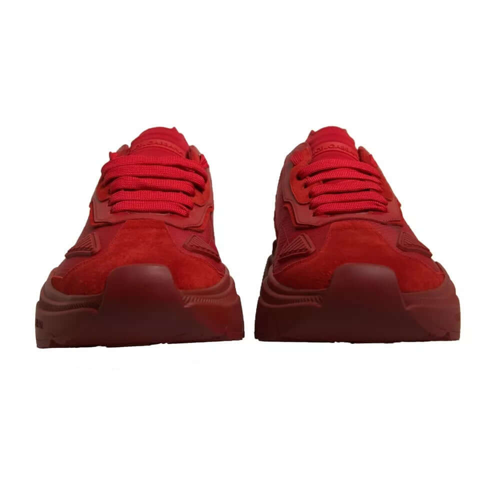 Dolce & Gabbana Daymaster red leather low top sneakers showing front view with rubber sole and logo details.