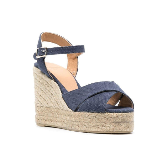 Navy blue Castaner Blaudell wedge sandals with buckle strap, open toe, braided raffia platform and leather trim.