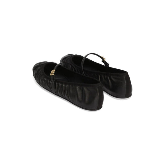 Black Dolce & Gabbana Nappa leather ballet flats with side buckle, leather sole, and gold-tone logo plaque.