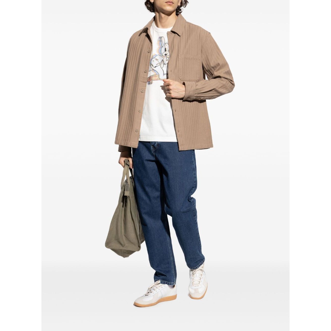 Person wearing PS By Paul Smith T-shirts and Polos White with logo print, crew neck, and short sleeves, styled with casual outfit and sneakers.