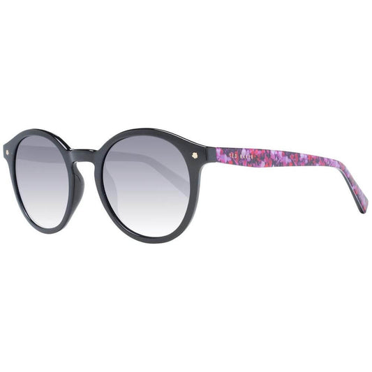 Ted Baker black round women's sunglasses with blue gradient lenses and floral temple design, providing 100% UVA & UVB protection.