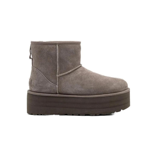 Alt Tag: Women's UGG gray suede leather boot for fall/winter, 100% suede composition, stylish and cozy footwear.