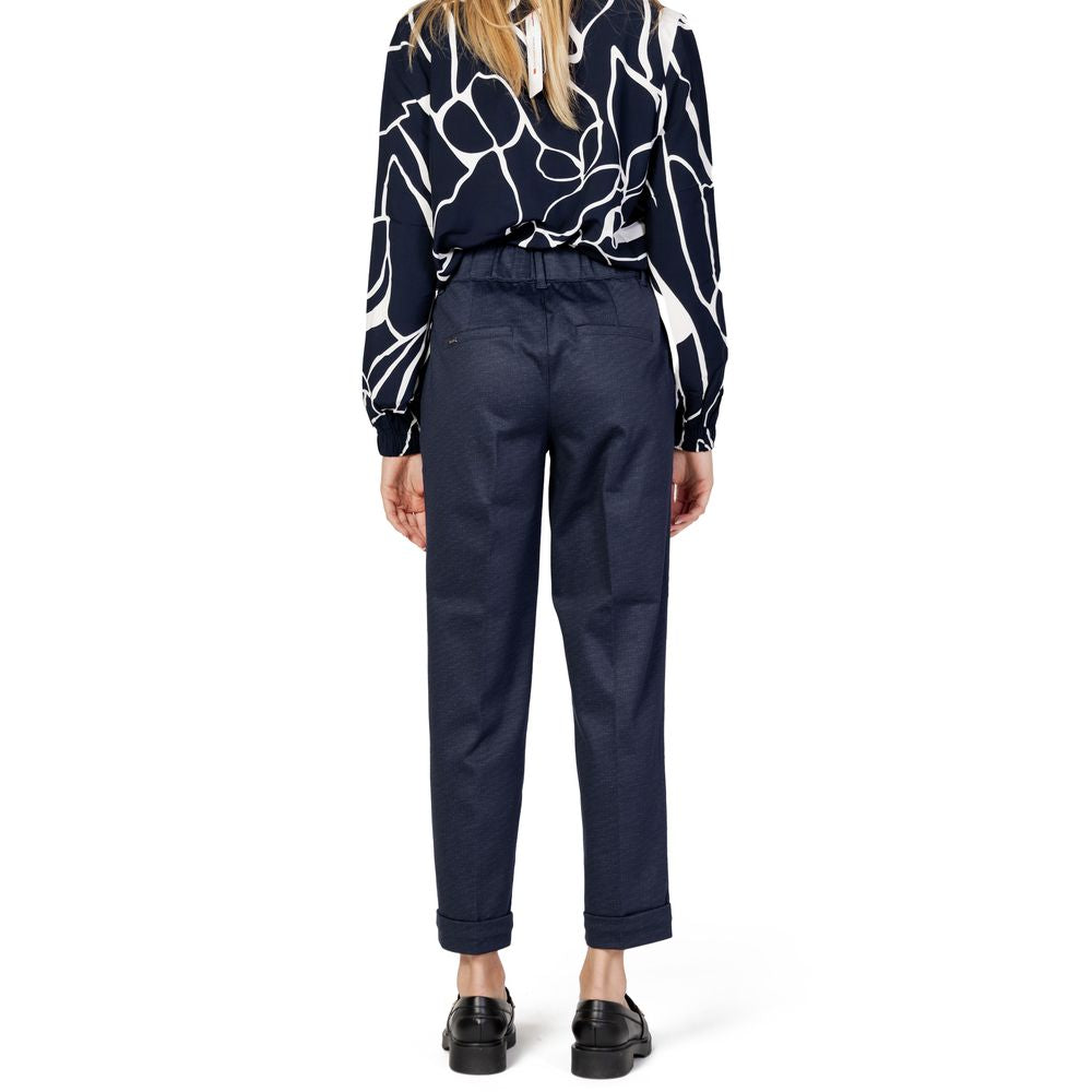 Back view of a model wearing Street One Blue Viscose Pant with high waist and tapered fit, paired with a patterned blouse.