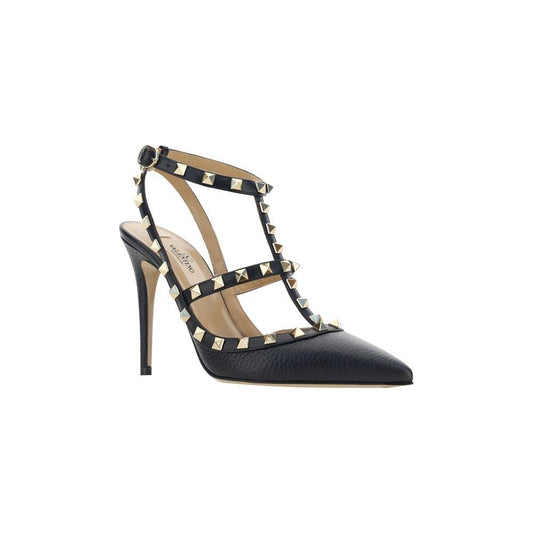 Valentino Garavani Rockstud pumps in black leather featuring iconic stud detailing and an adjustable ankle strap for a bold, elegant look.
