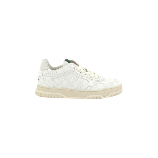Gucci Logo Leather Sneakers with GG monogram and lace-up closure, featuring iconic applique and knurled sole for stylish elegance.
