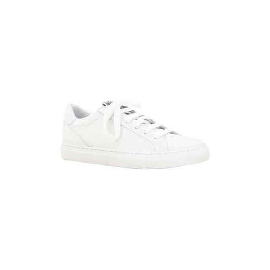 White Brunello Cucinelli calfskin sneakers with elongated toe and lace-up front, featuring a jeweled front label and flat sole.