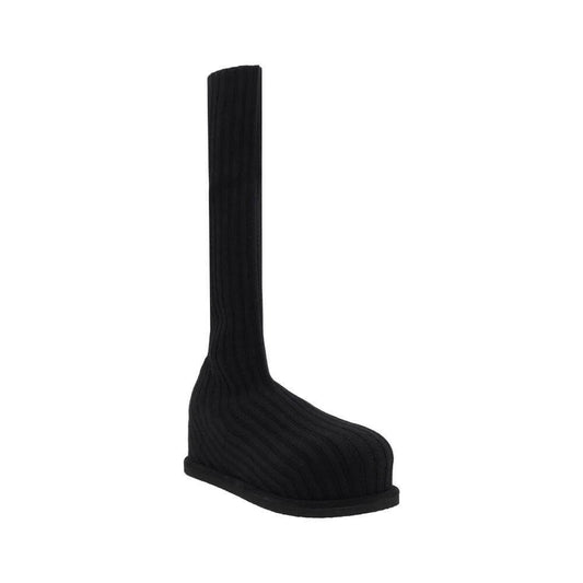 Amina Muaddi Veneda Stretch Boots with ribbed stocking effect, round toe, and flat sole in black wool.