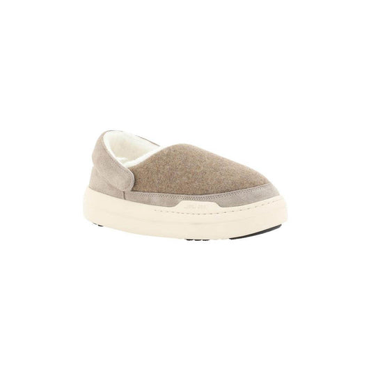 Moon Boot Mule with suede detailing, round toe, shearling interior, textured non-slip sole, and brand monogram slingback.