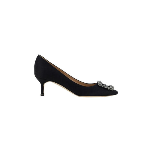 Black Manolo Blahnik Hangisi Pumps with Swarovski crystal buckle and almond toe, featuring leather stiletto heel and logo-embossed insole.