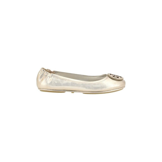 Tory Burch Minnie Ballerinas in metallic leather with round toe and logo plaque, featuring elasticized heel for comfort.