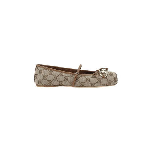 Gucci GG Ballerinas with iconic GG pattern, featuring a square toe, bow detail, and buckle strap for modern elegance.