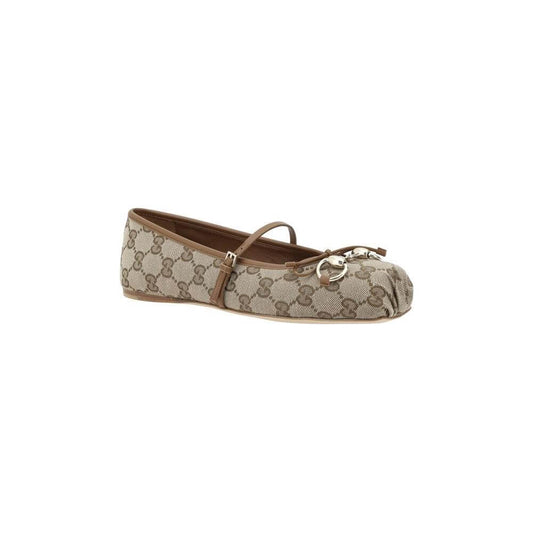 Gucci GG Ballerinas with canvas, square toe, and buckle strap. Features all-over iconic GG pattern and bow detail for modern elegance.