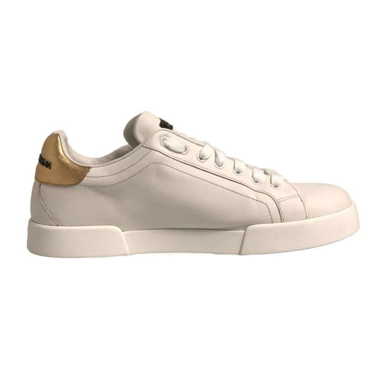 Dolce & Gabbana white Portofino sneakers with gold heel patch, leather upper, lace-up closure, and branded details. Exclusive Italian design.