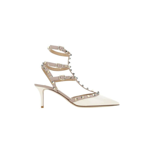 Valentino Garavani Rockstud Pumps in patent leather with iconic studs, adjustable ankle strap, and stiletto heel for bold elegance.
