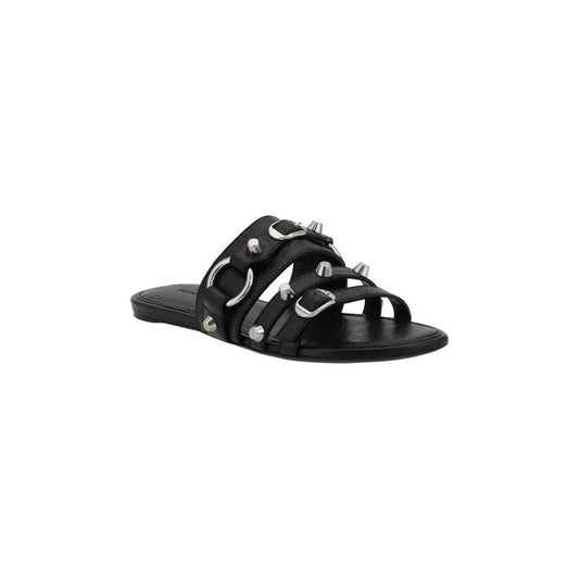 Balenciaga studded sandals with three straps and silver studs, flat sole, and modern design for a stylish summer look.
