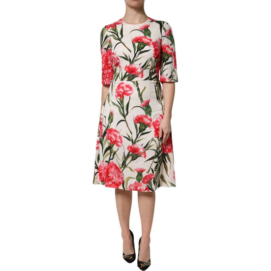 Dolce & Gabbana pink floral print sheath dress with short sleeves, made of silk and elastane, featuring zipper closure and exclusive craftsmanship.