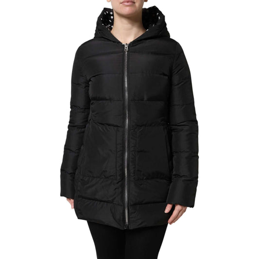Dolce & Gabbana black puffer hooded jacket with zip closure, 100% polyester, reversible design, luxury craftsmanship, made in Italy.