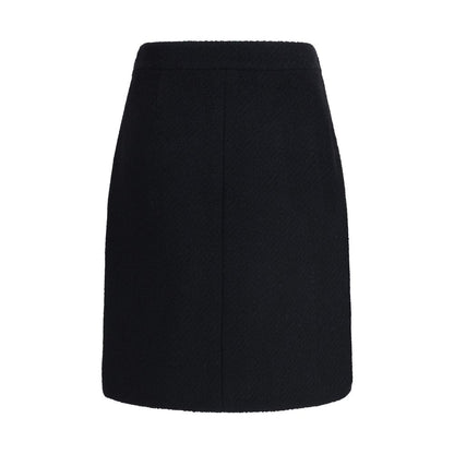 Chloé Black Wool Midi Skirt with front flap pockets, gold-tone buttons, crafted from premium bouclé wool, side zip and hook fastening.