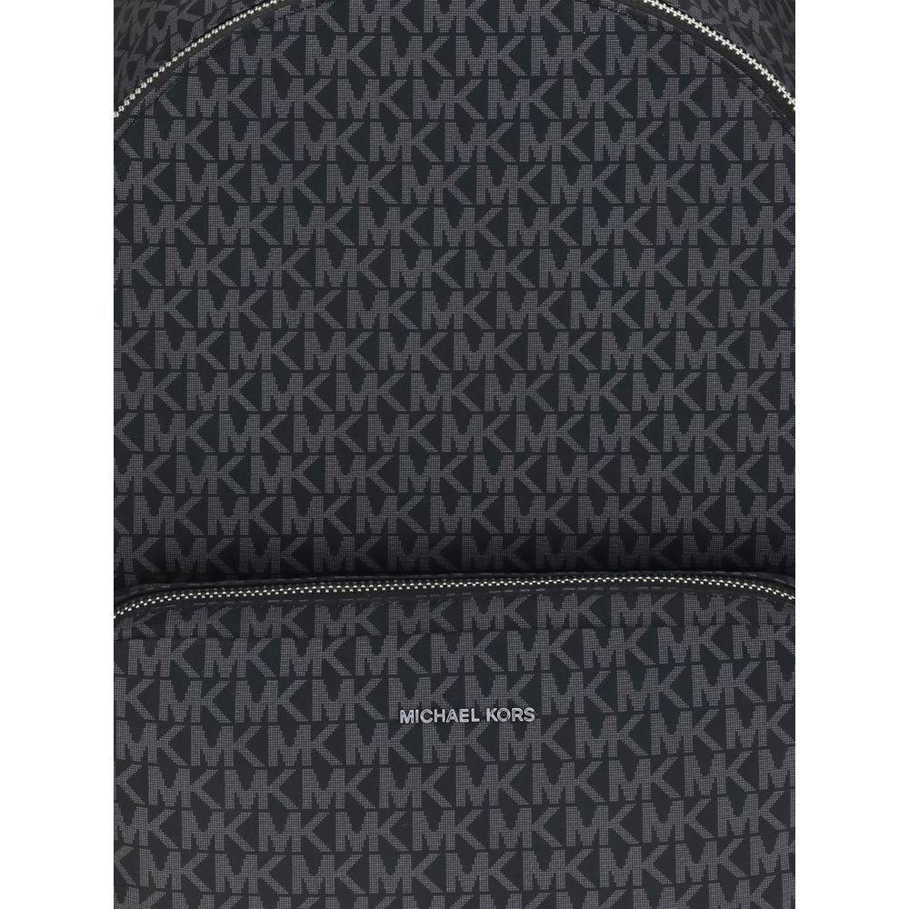 Closeup of Michael Kors Black Polyester Backpack with logo-printed canvas design, featuring zippered front and sophisticated minimalist style.