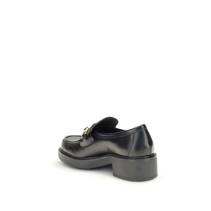 Gucci Black Calf Leather Bos Taurus Slip-On Loafers with horsebit detail and block heel, side view.