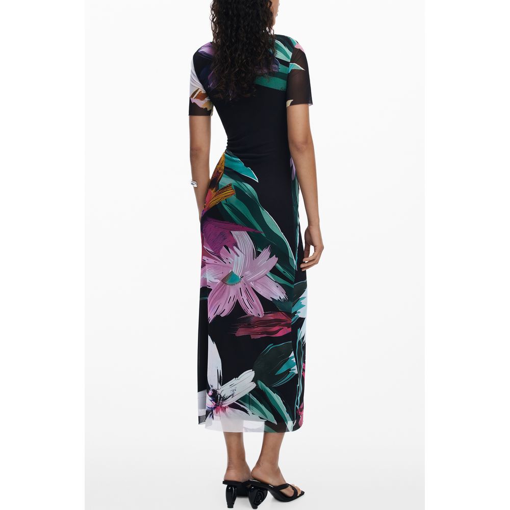 Woman wearing Desigual Black Polyester Women Dress with colorful floral patterns, showcasing long design with short sleeves, back view.