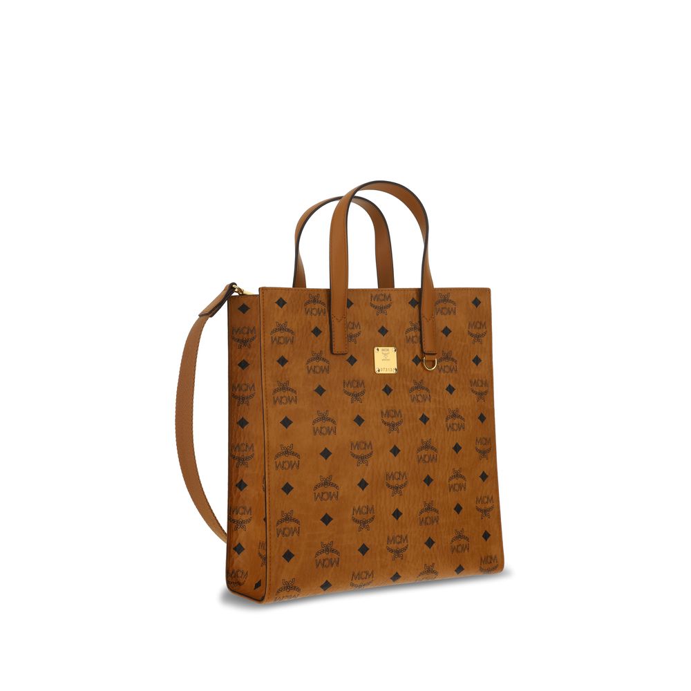 MCM Brown Polyethylene Shoulder Bag with monogram pattern and adjustable removable strap, featuring brand logo plaque and interior pockets.